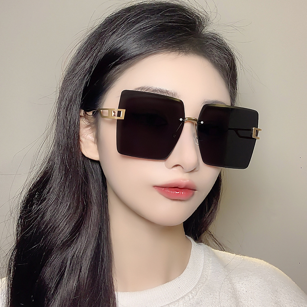 Fashion personality trim frameless sunglasses large frame anti-ultraviolet sunglasses men and women with the same sunglasses wholesale