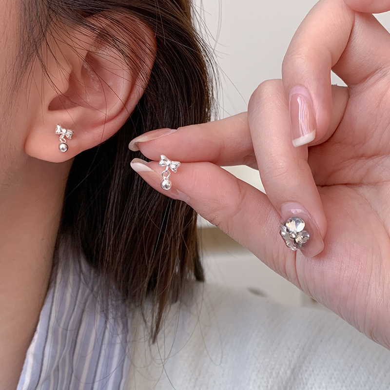 999 pure silver bowknot round bead stud earrings women's simple cold wind rotating screw twist buckle silver bead earrings E0909