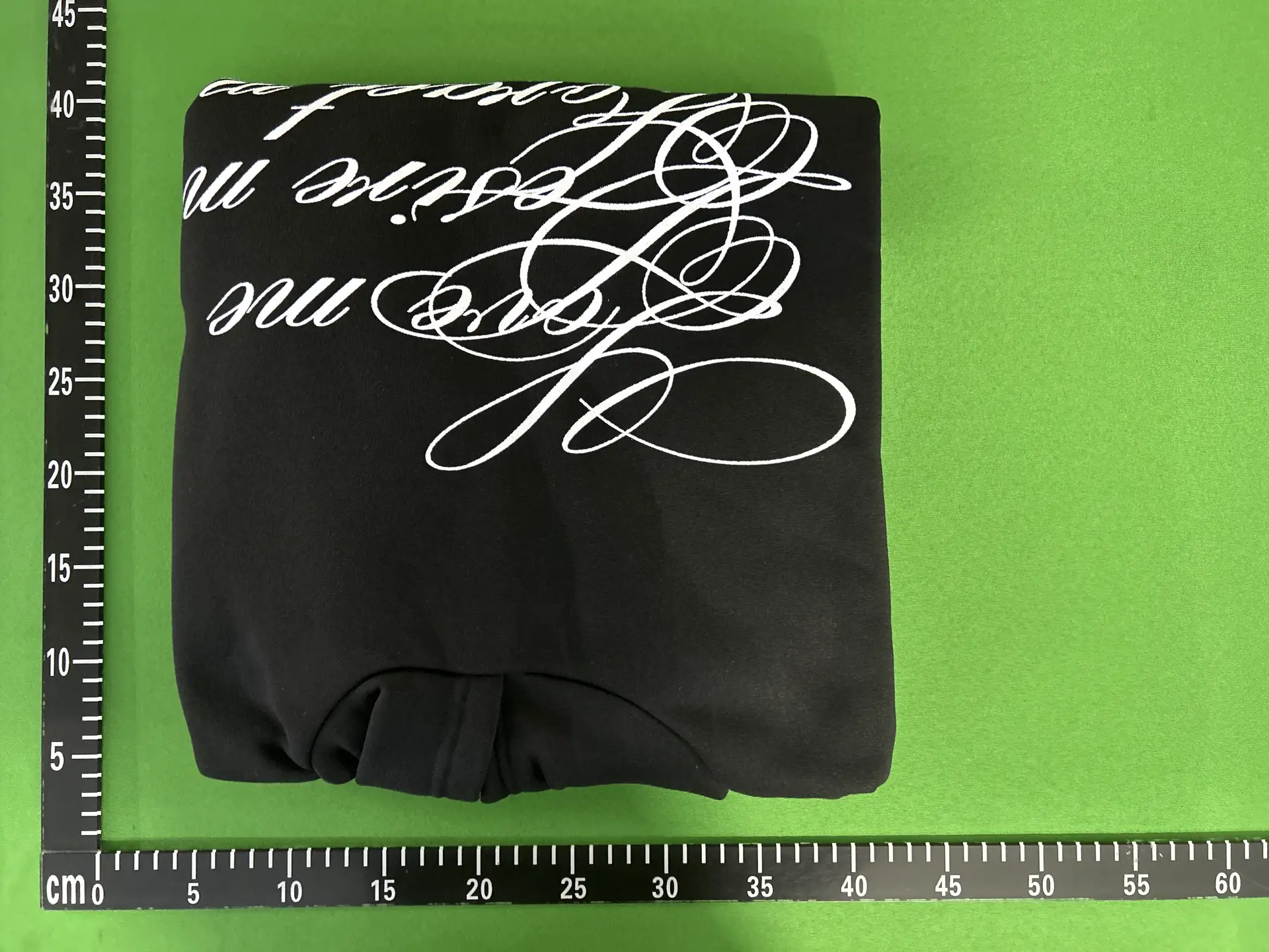 Black hoodie with white script print