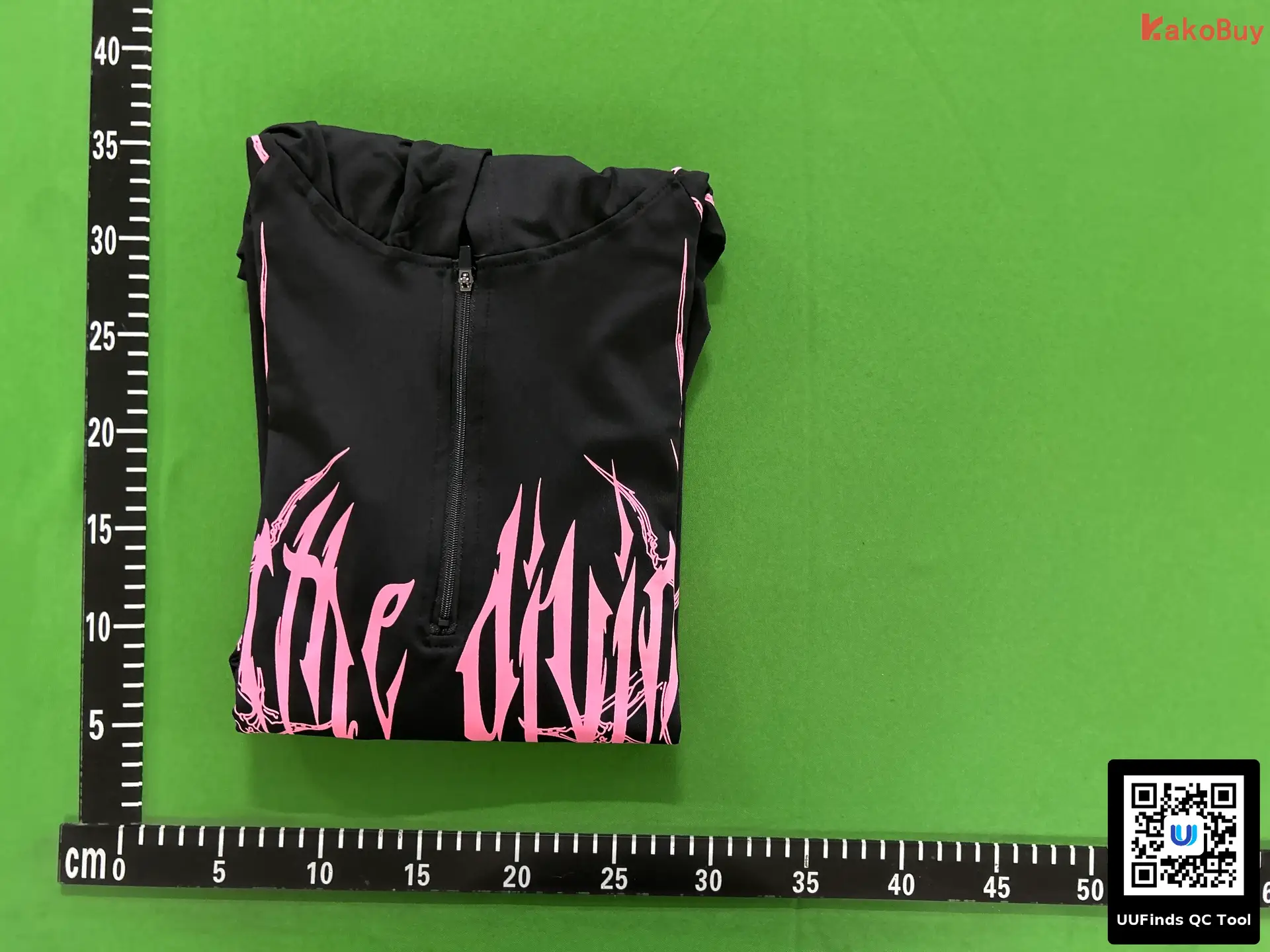 Black long sleeve half zip top with pink graphic print