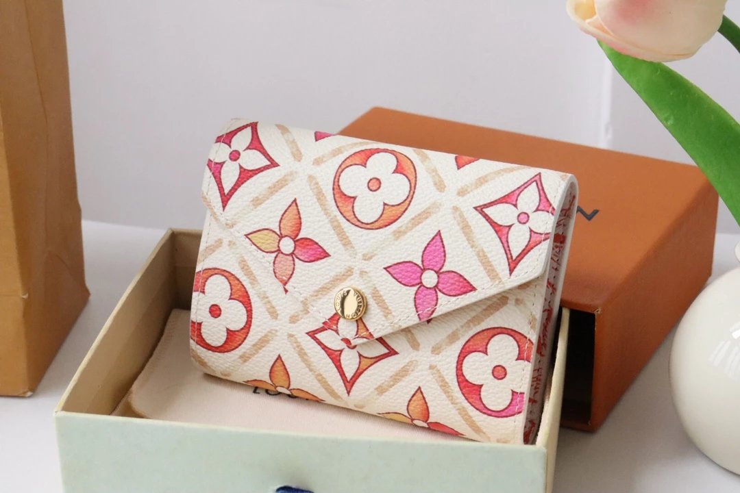 Top-grade original M83623: This Victorine wallet from the By the Pool Summer Collection is reimagined in coated canvas, adorned with a striking Monogram Tiles print inspired by Mediterranean motifs. This compact envelope-style wallet features a distinctive square...