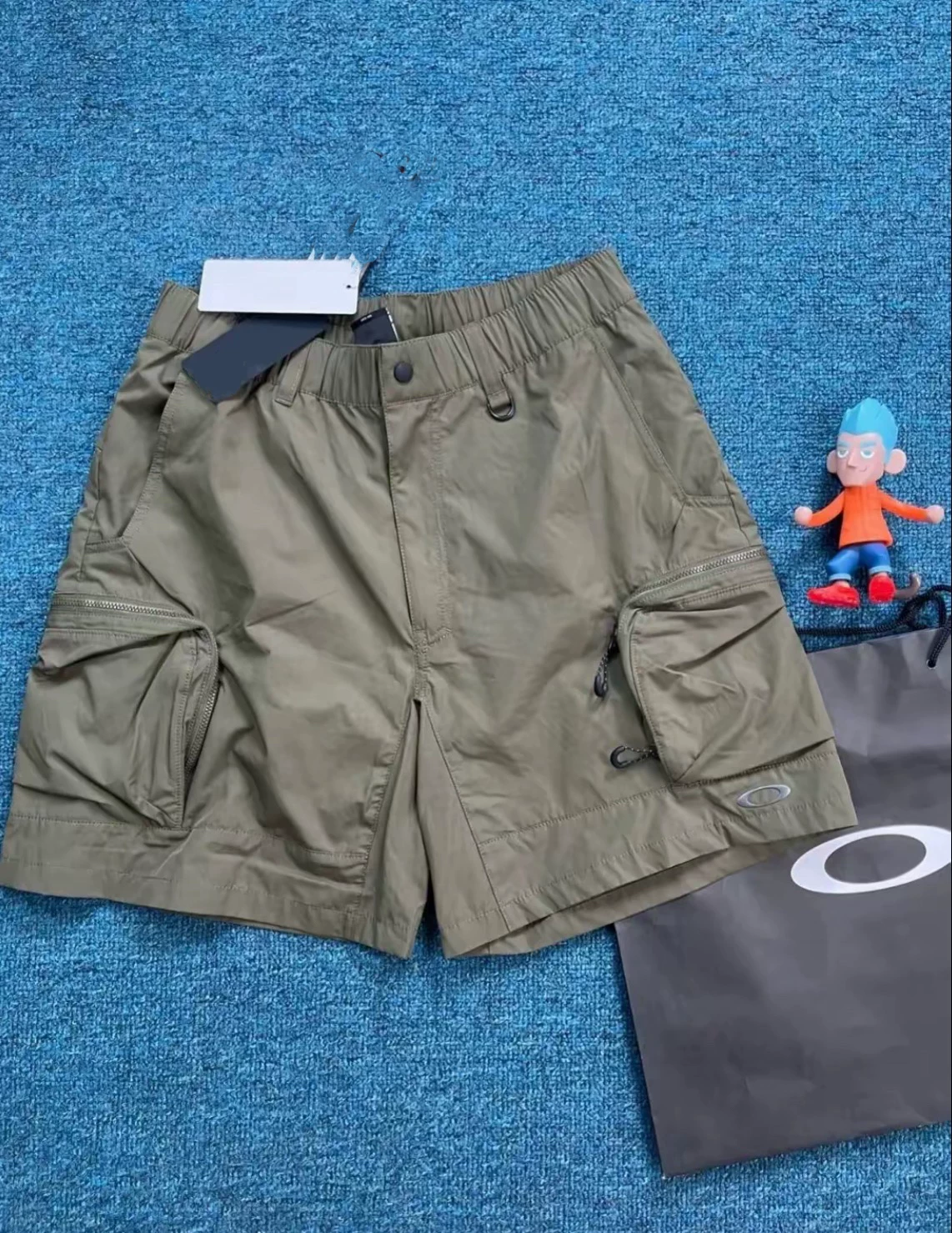 In-Stock Oakley Mountain-Style Outdoor Three-Dimensional Cut Loose-Fitting Large Pocket Quick-Drying Men's Summer Commuting Five-Point Shorts Foto QC de TAOBAO na Qualit.ly