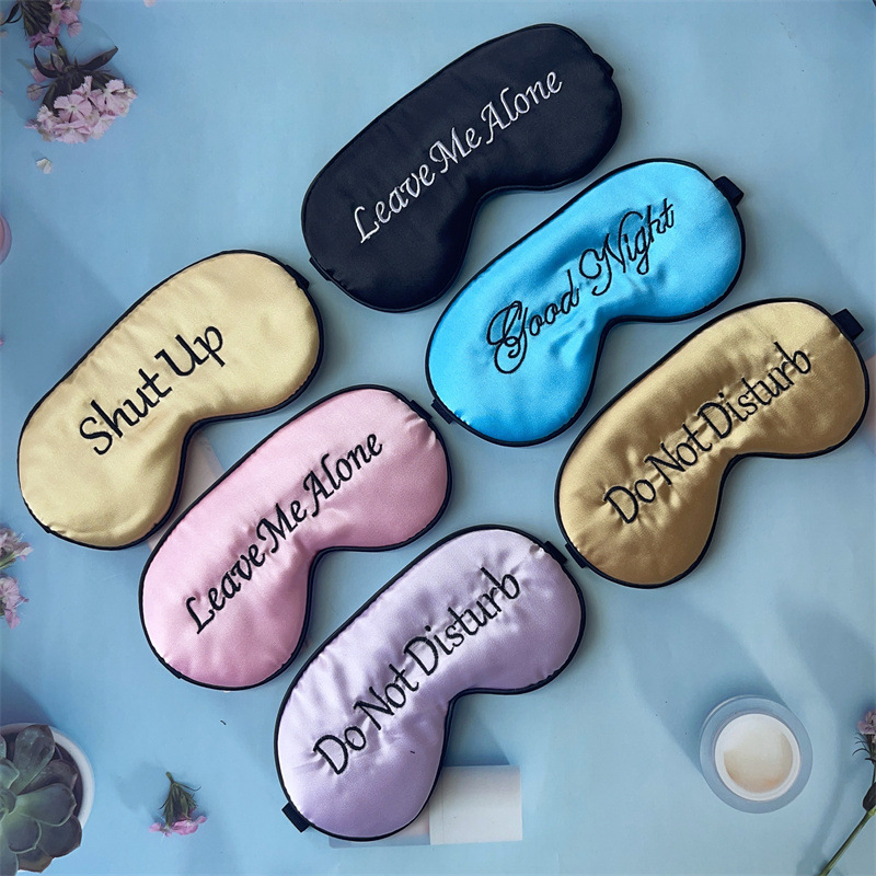 Imitation silk embroidery eye mask shading sleep eye mask English pattern embroidery logo shading eyelash eye mask now