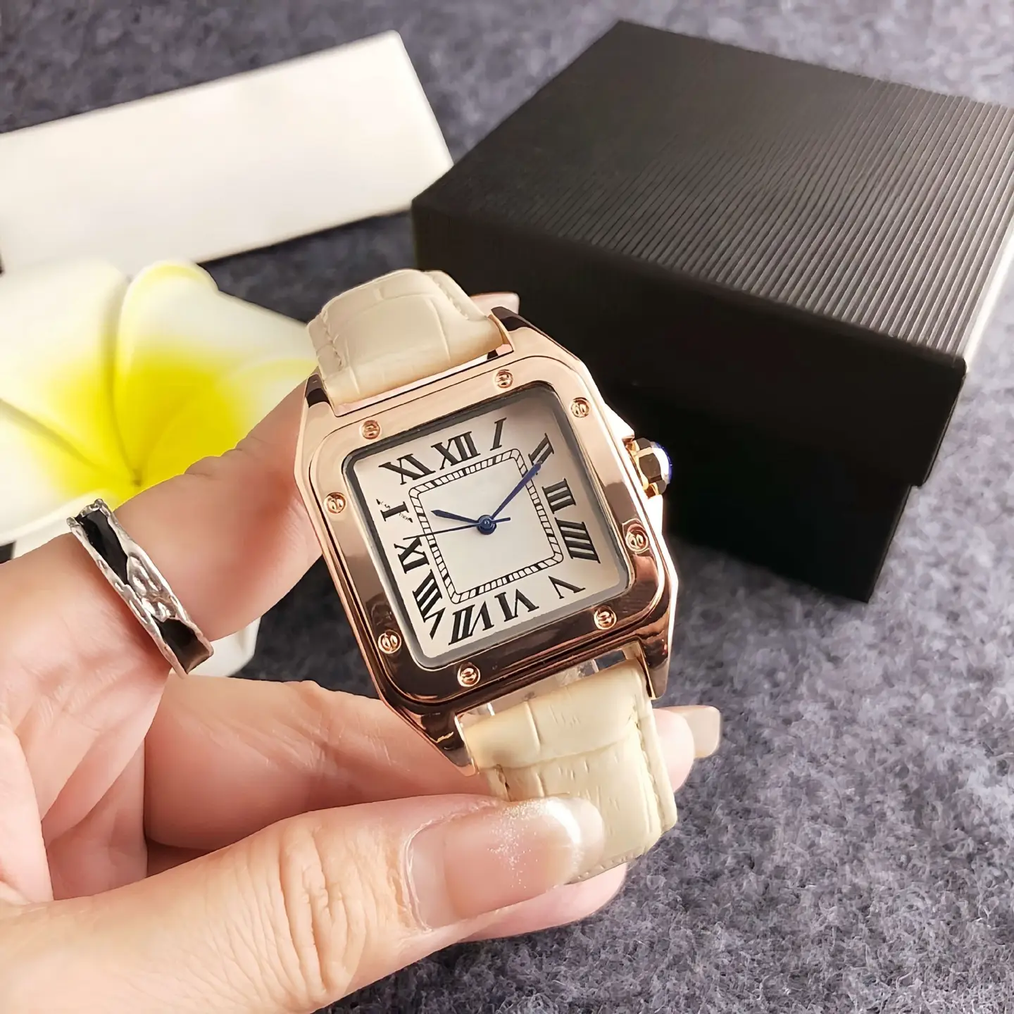 Square watch with cream leather strap