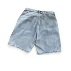 Vertical Lines on the Back Pocket, Cut-Out Details on the Front Left Leg, Light Blue Denim Shorts 33122911