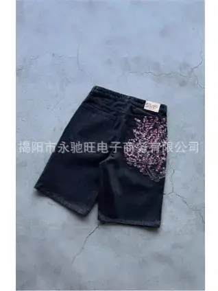 Black denim shorts with sequin floral detail
