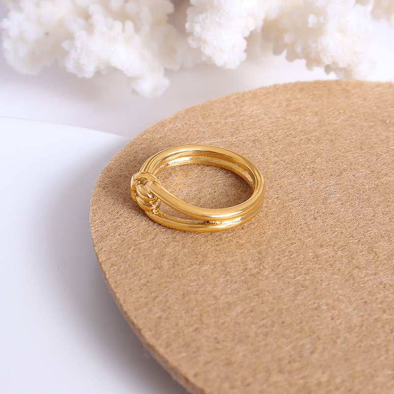 New French ins Europe and the United States exaggerated personality stacked knotted hollow simple ring female titanium steel 18k gold factory wholesale