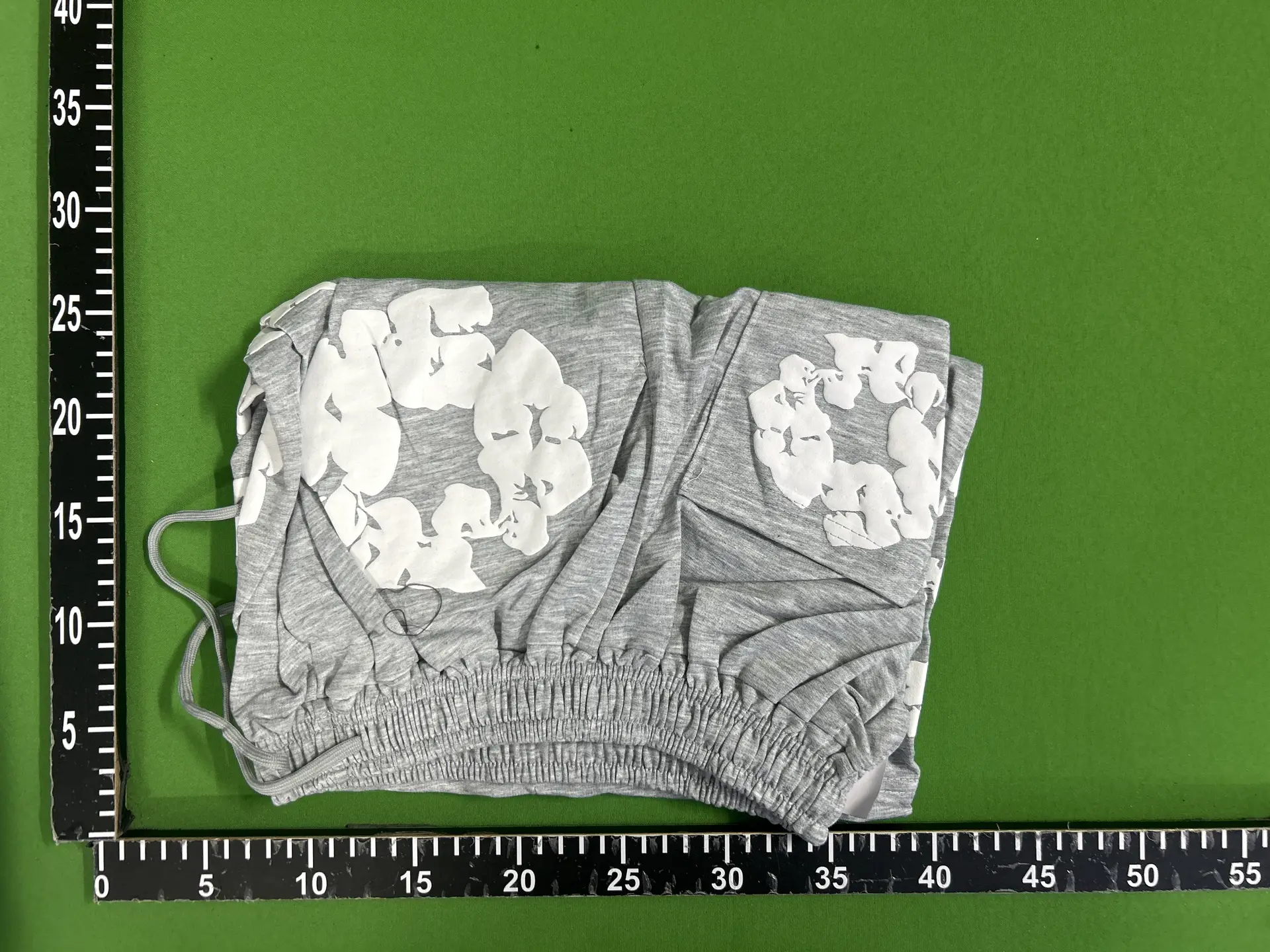 Grey shorts with white floral print