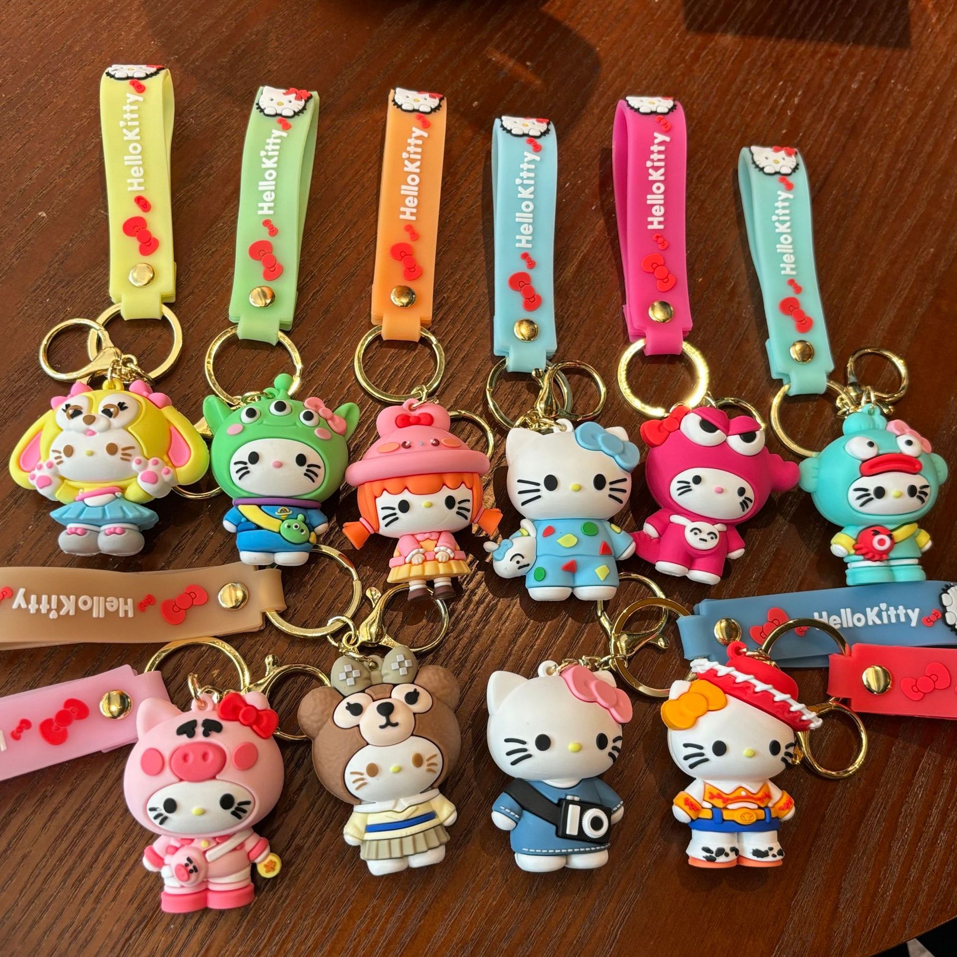 HelloKitty cross-dressing key chain KT cat Sanrio doll pendant car key chain catching baby machine small gift