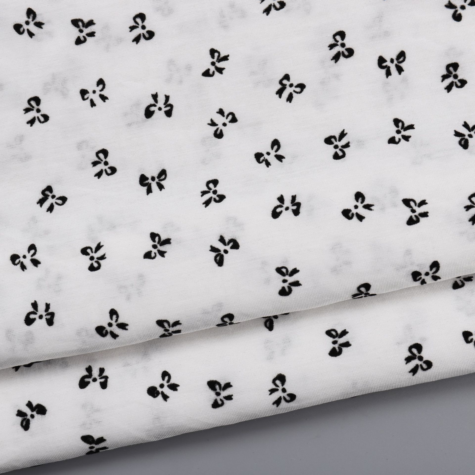 Woven nylon rayon fabric spring and summer light hanging children's clothing belt dress home clothing bow flocking fabric