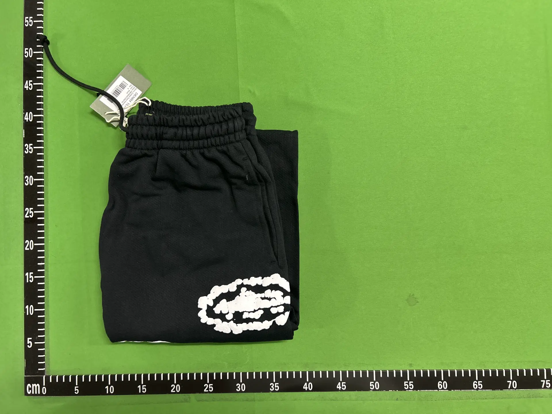 Black sweatpants with white graphic print