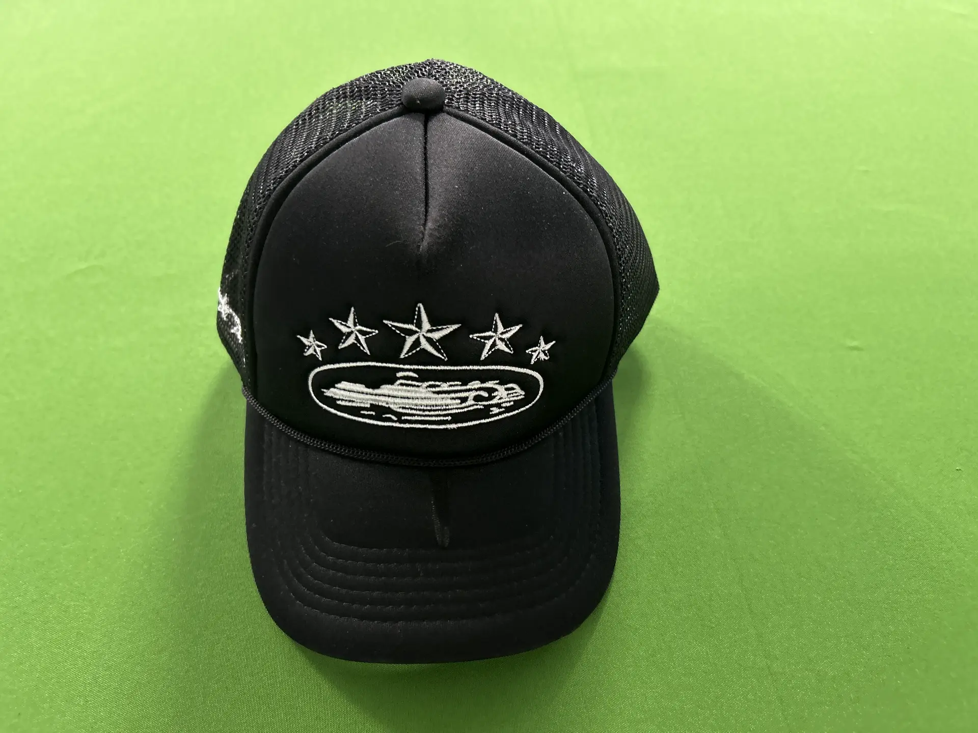 Black trucker hat with embroidered design