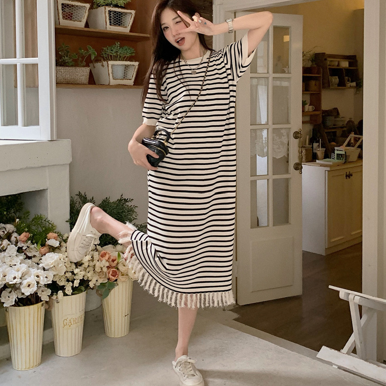 2023 spring and summer contrast color ice silk striped knitted dress women's loose belly covering slimming tassel black dress women