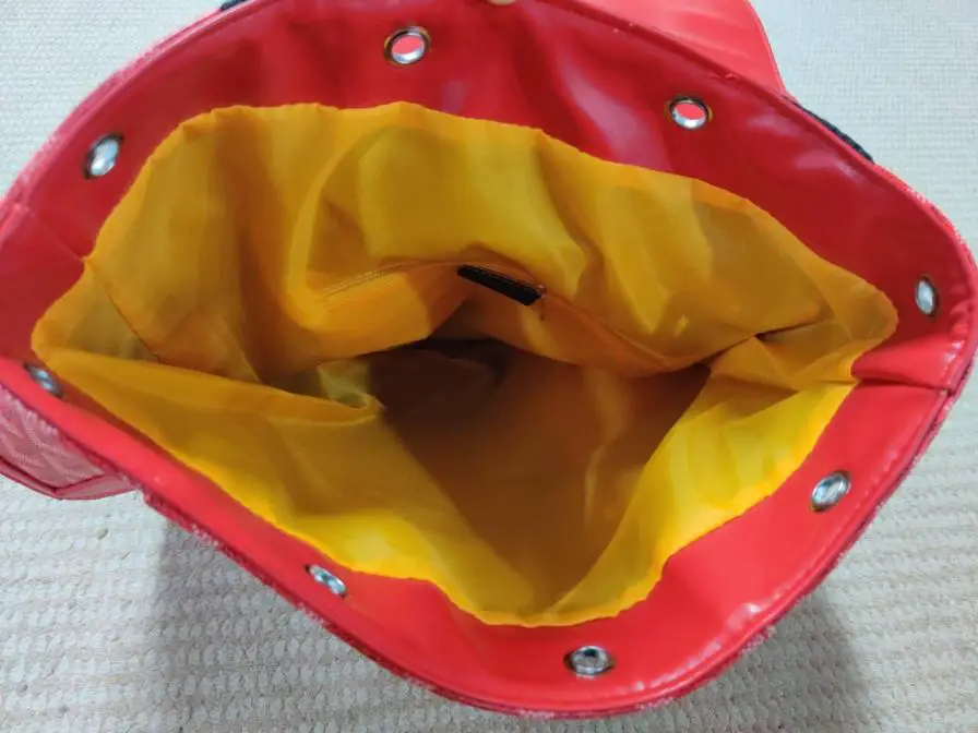 Red backpack with yellow lining