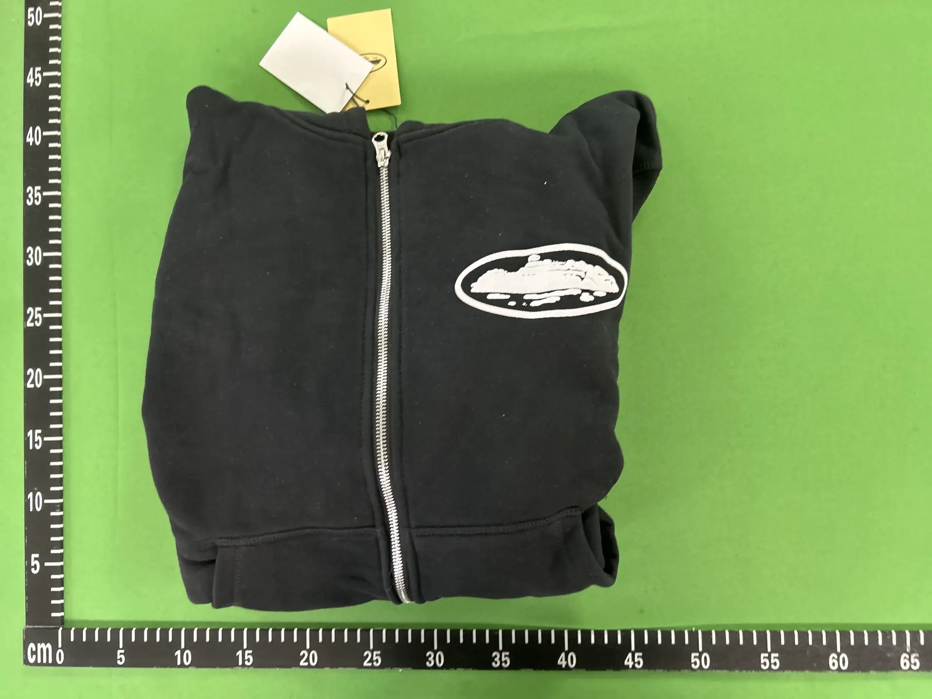 Black zip-up hoodie with oval logo