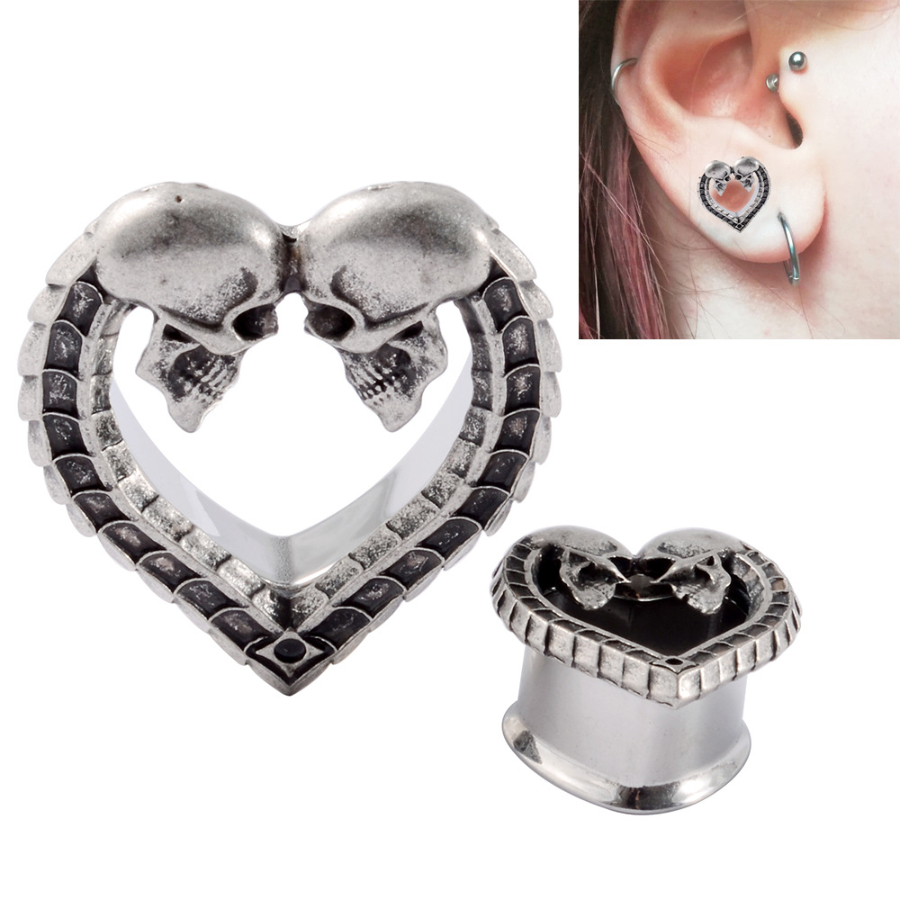 Cross-border one-piece heart-shaped hollow horn auricle stainless steel ancient silver skull bone pattern ear expansion piercing earrings