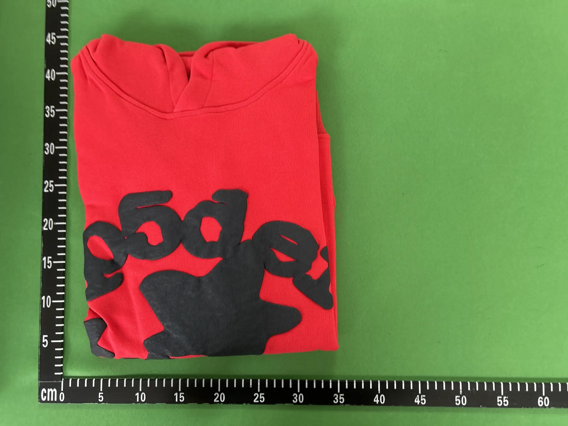 Red hoodie with black graphic