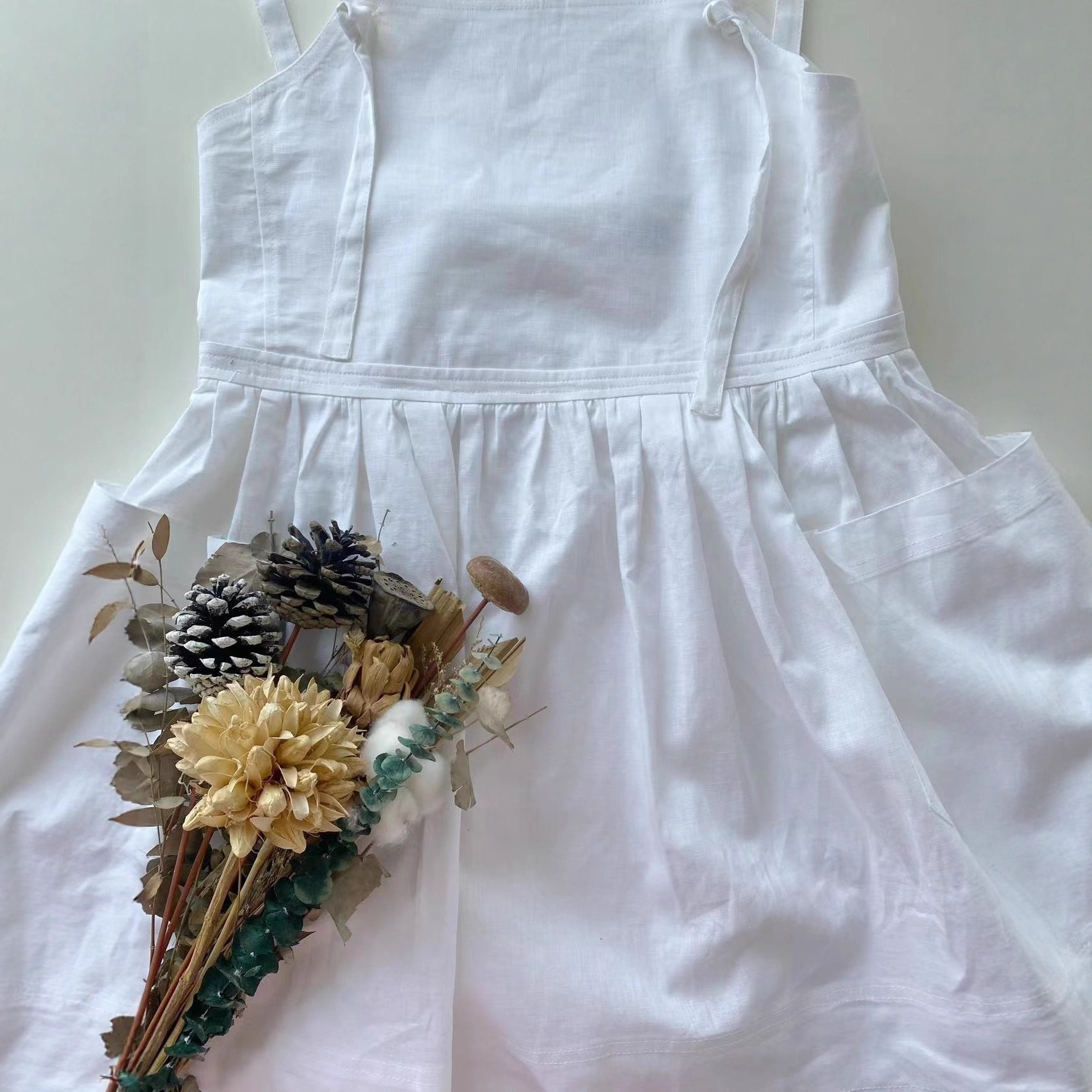 Now, Korean Designer Dongdaemun Has Released a White Suspender Linen Cotton Cute Dress