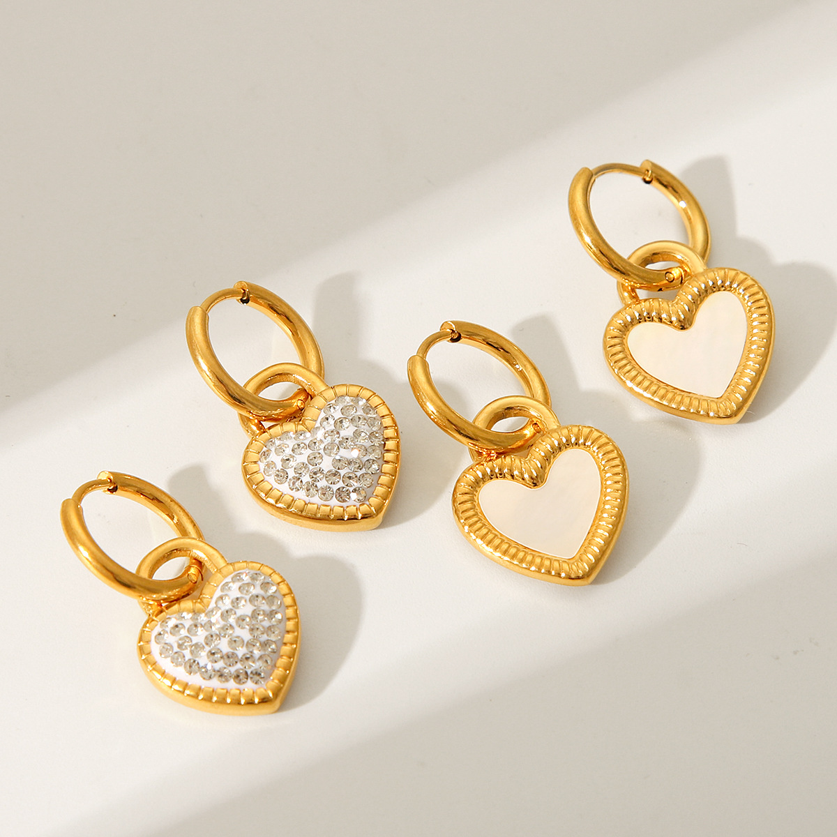 Europe and the United States 18K gold-plated stainless steel love white shell pendant earrings INS style fashion heart-shaped diamond titanium steel earrings women