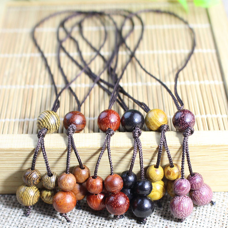 Factory wholesale simple wind wooden bead pendant sandalwood small pendant men's and women's small jewelry bag mobile phone chain simple personality