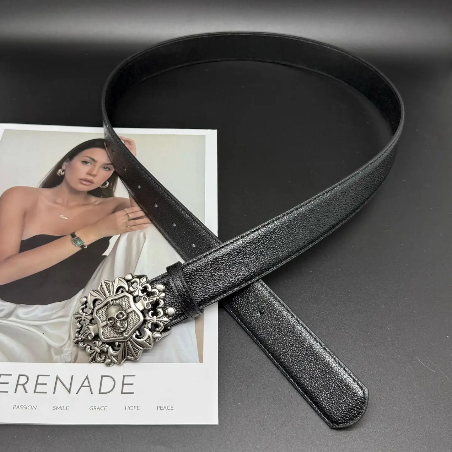 Black leather belt with skull buckle