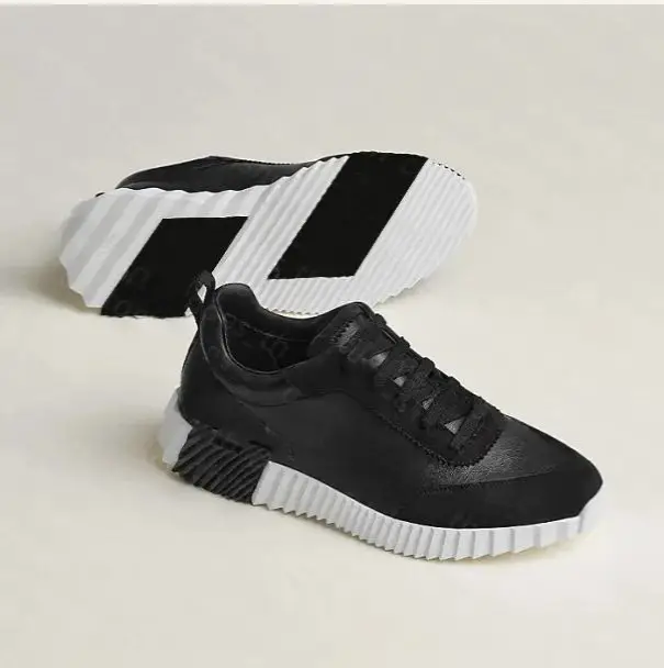 Spot flyknit mesh men's shoes European summer breathable luxury big brand outdoor leisure lightweight driving traveling shoes