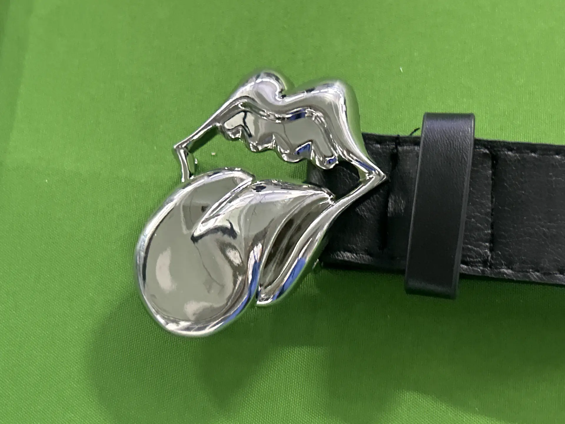 Black leather belt with silver lips buckle