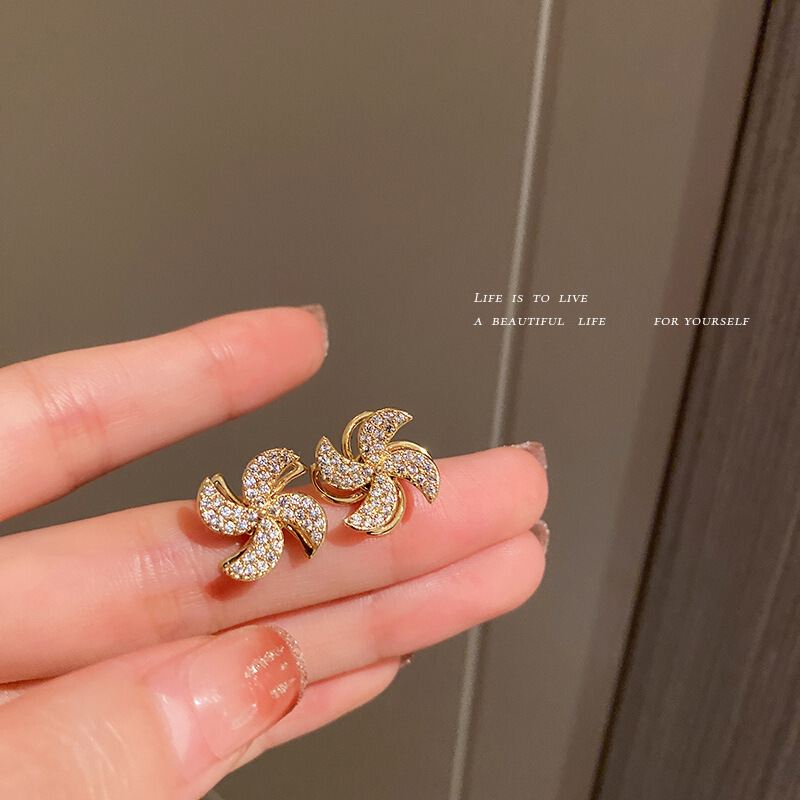 Rotatable windmill earrings female niche temperament light luxury rotating earrings French high-grade inlaid zircon gold earrings