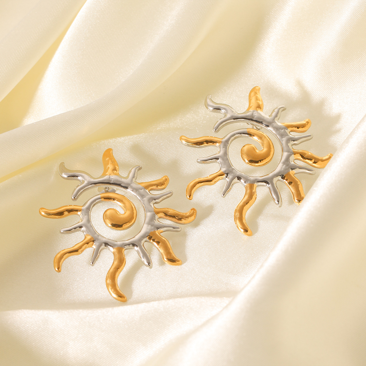 European and American ins light luxury high-end color matching earrings 18K gold stainless steel rotating thread sun earrings cross-border jewelry