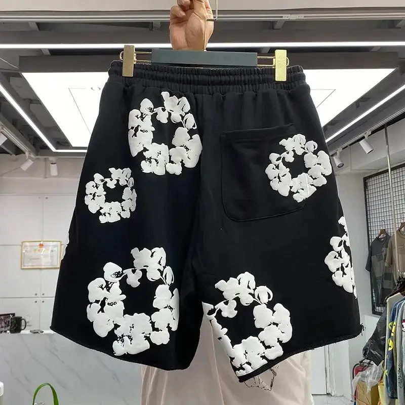 Black shorts with white floral print