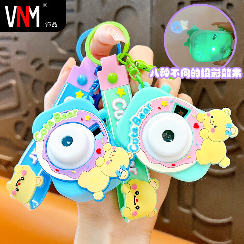 Creative new cream bear projection camera keychain cute schoolbag pendant car key chain gift wholesale