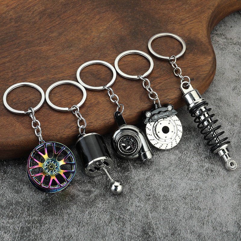 Creative metal keychain Turbine Gear wheel hub brake disc shock absorber caliper car keychain pendant wholesale QC-foto från 1688 på Qualit.ly