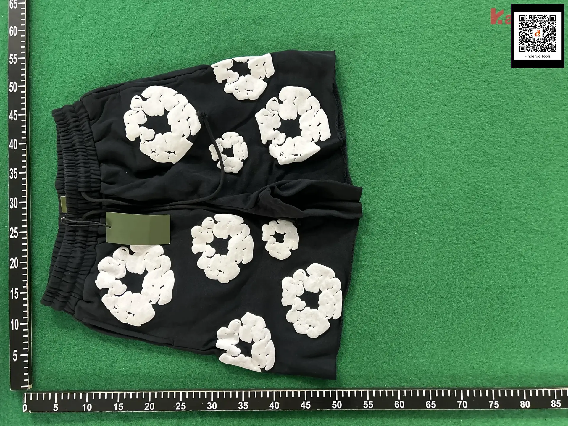 Black shorts with white floral print