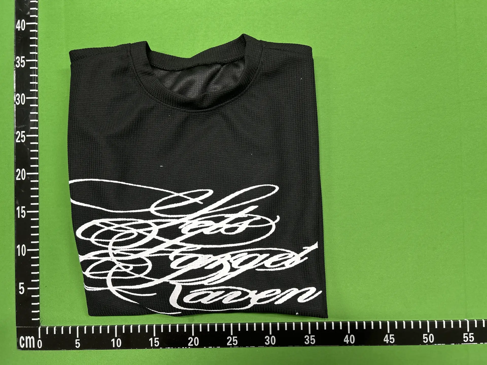 Black T-shirt with white graphic print
