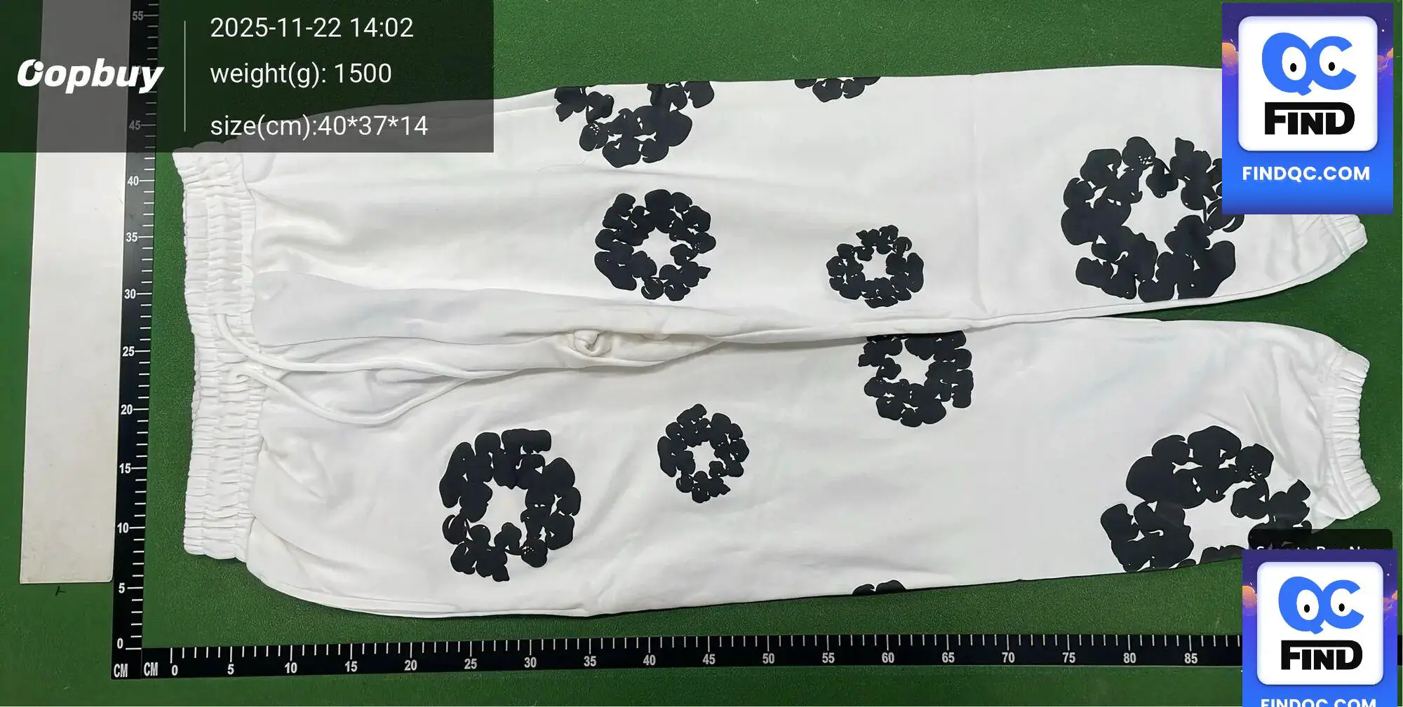 White sweatpants with black floral print