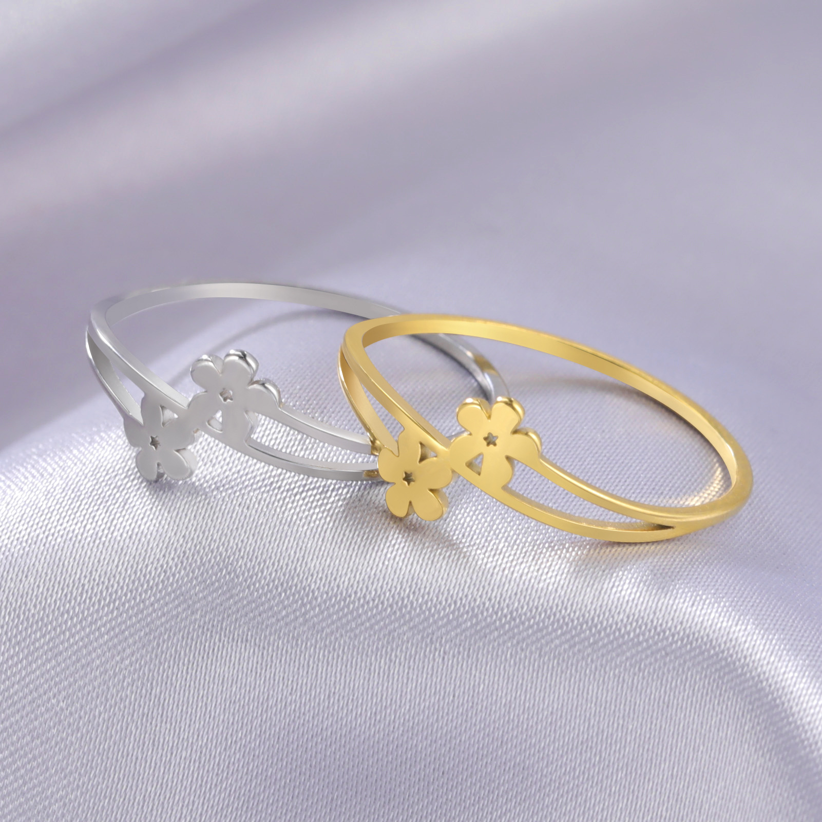 Foreign trade hot titanium steel color gold two small flowers ladies ring factory direct stainless steel ring ring
