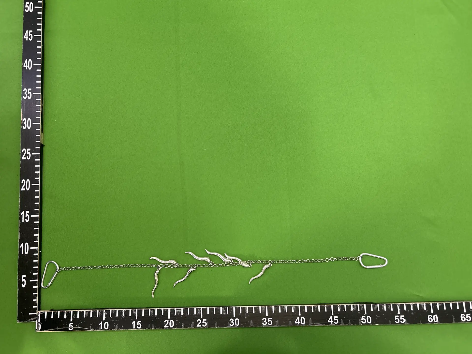 Silver metal chain necklace with horn charms