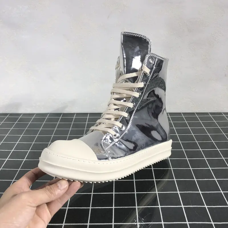 Men wearing round Owens high top shoes, women wearing silver plated glossy milk flavored thick soled dark style street fashion sneakers
