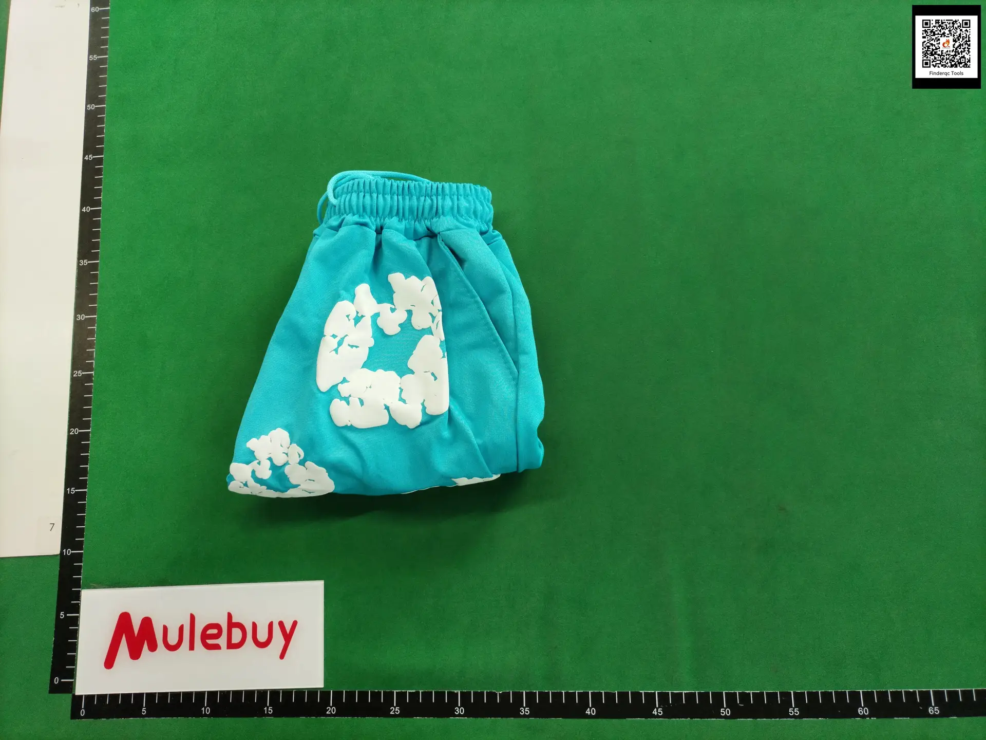 Turquoise shorts with white floral print
