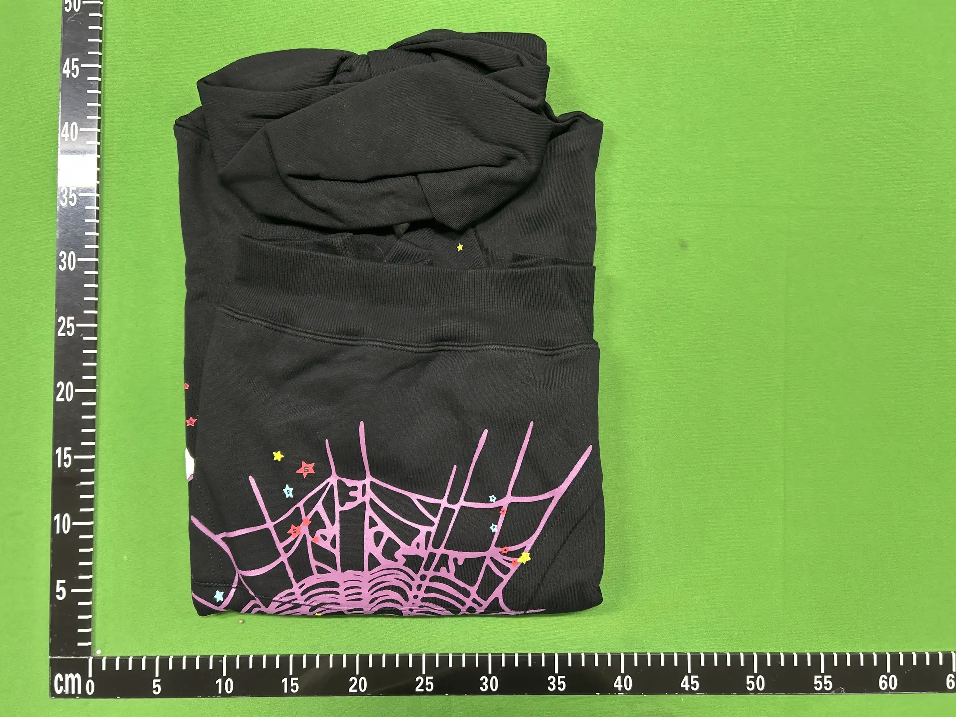 Black hoodie with spider web graphic