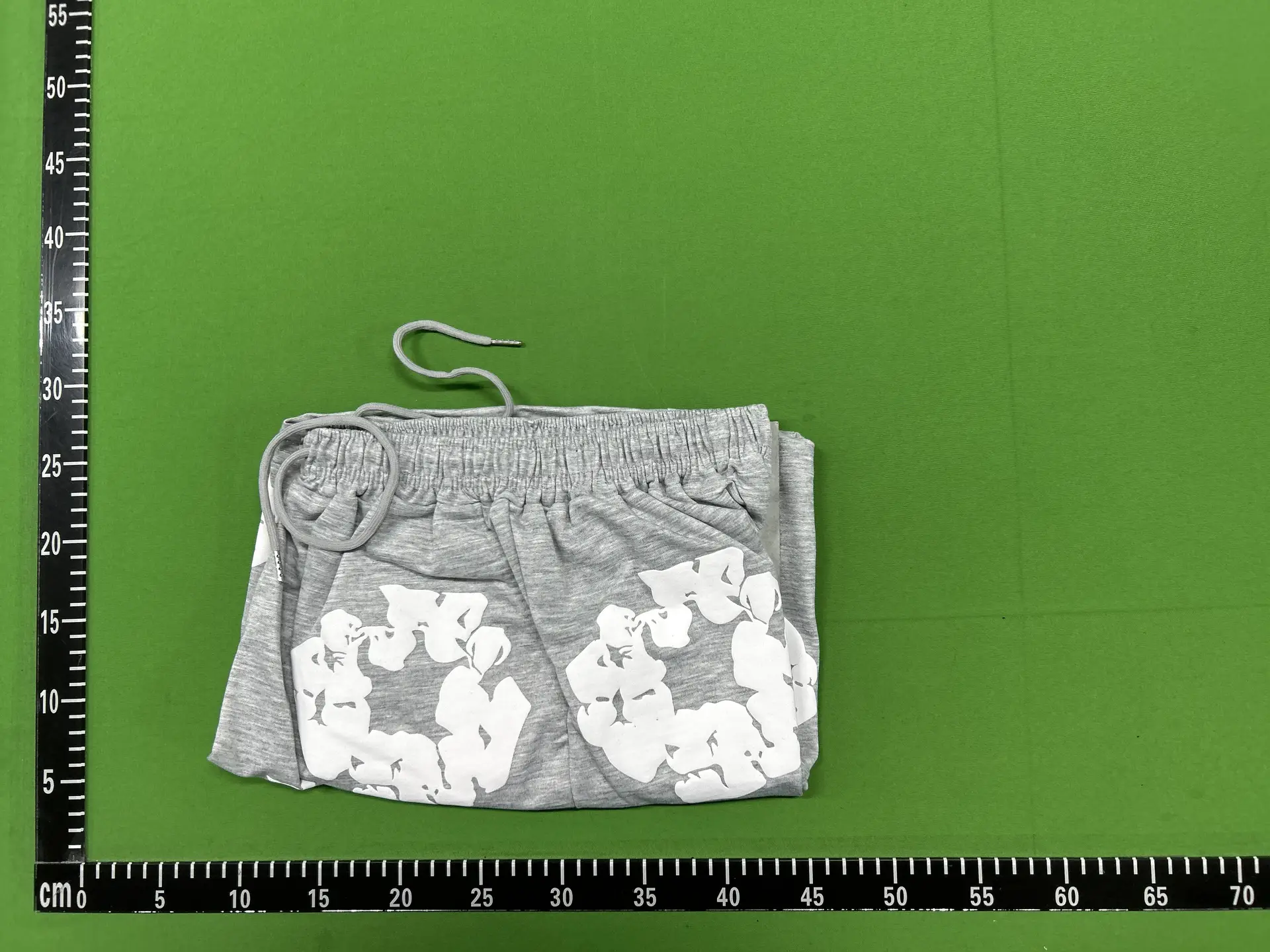 Grey sweatpants with white floral print