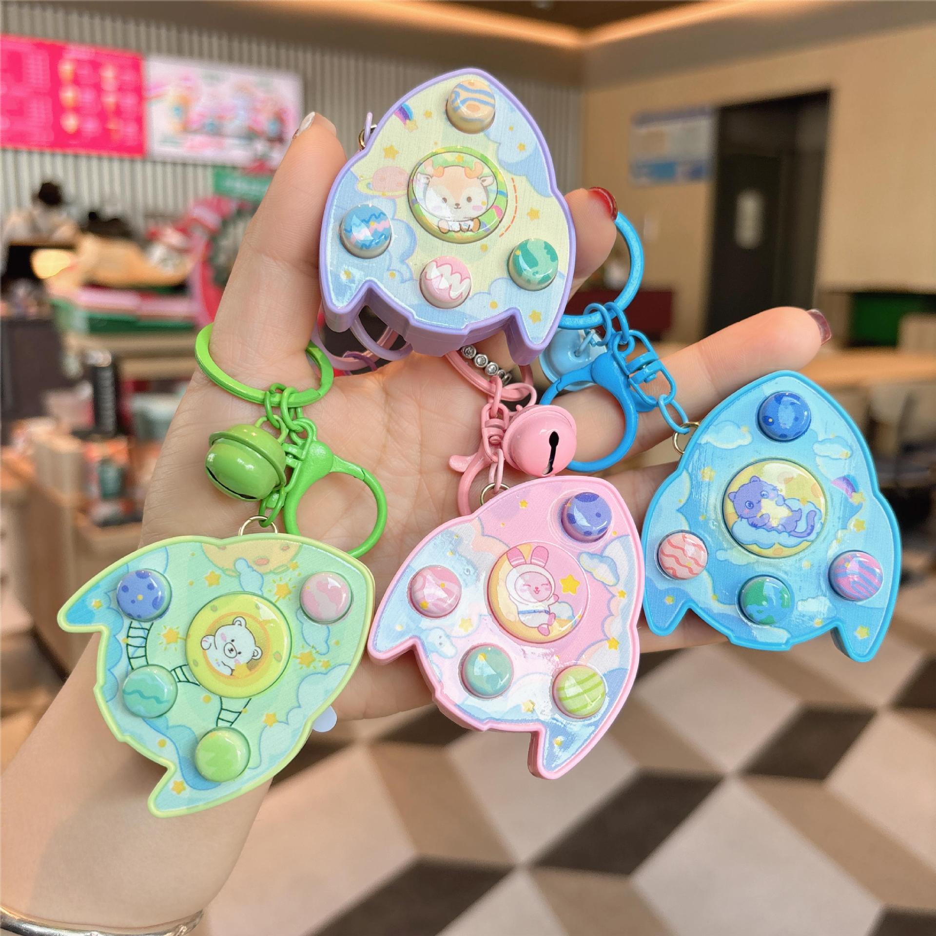 Cross-border Creative Children's Luminous Cartoon Rocket Sound Memory Electronic Game Machine Bag Pendant Doll Machine Toy