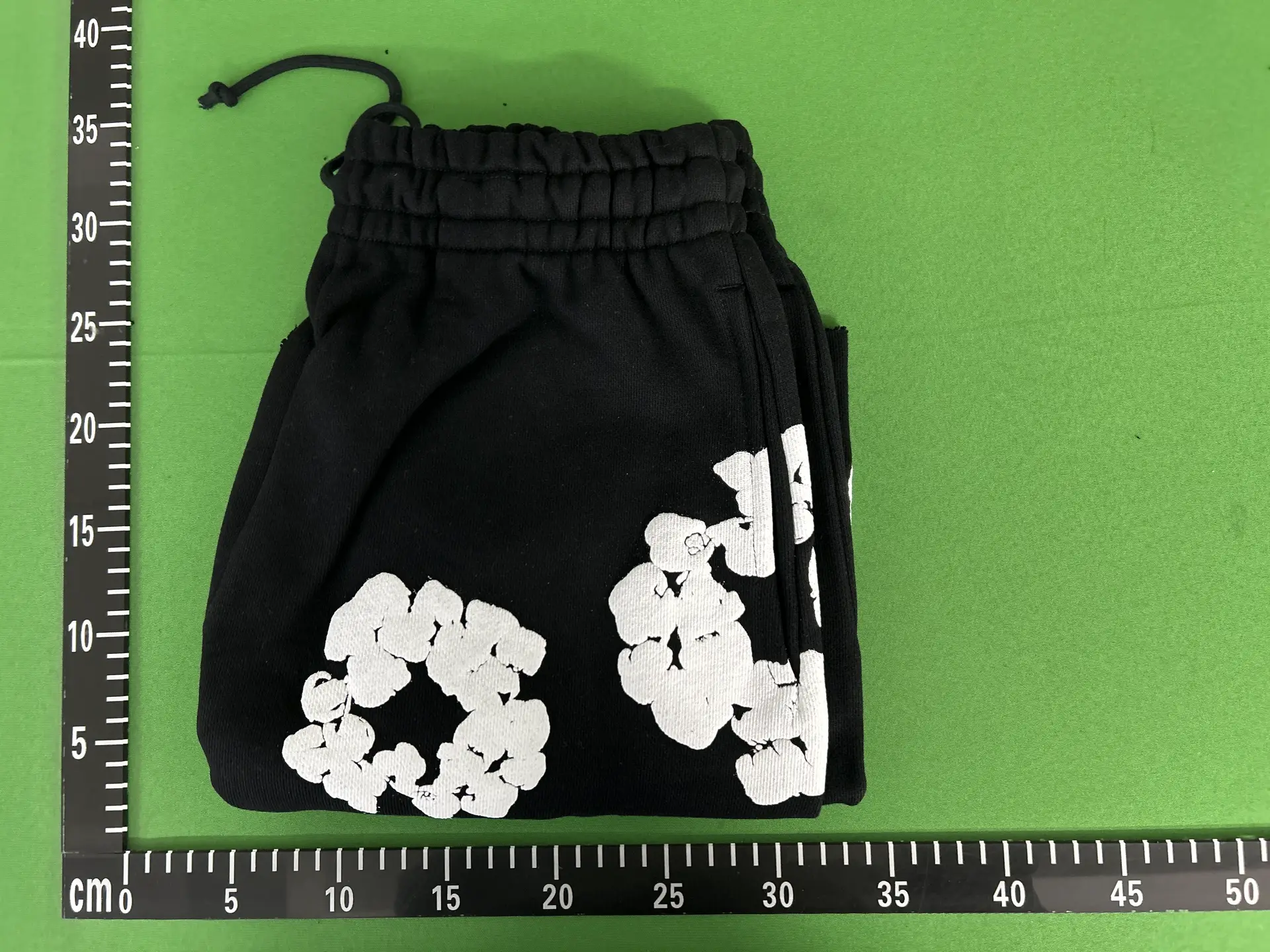 Black shorts with white floral print