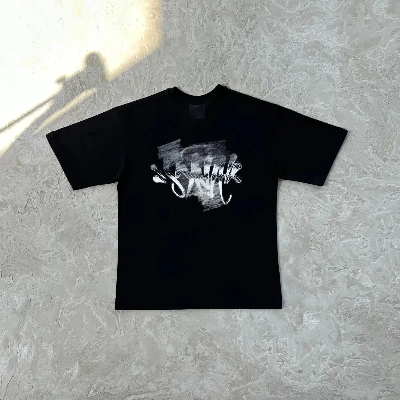 Black T-shirt with white graphic print