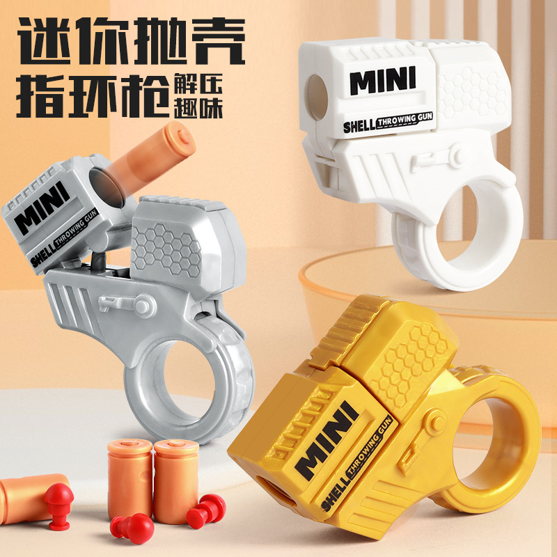 Children's Mini Finger Decompression Ring Rotating Gun Cool Can Launch Shell Boys Novelty Hotel Toys Wholesale