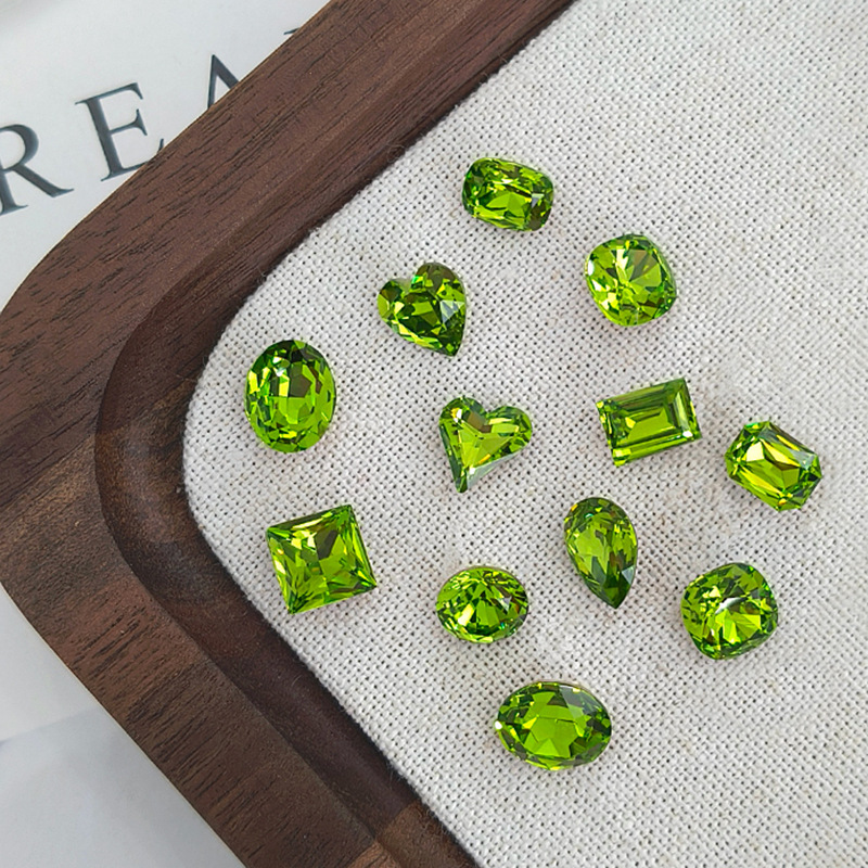 Dongzhou Crystal Platycodon Green Nail Art Diamond High Quality K9 Whole Batch Flashing Olive Green Pigeon Egg Pointed Bottom Diamond Nail Art Accessories