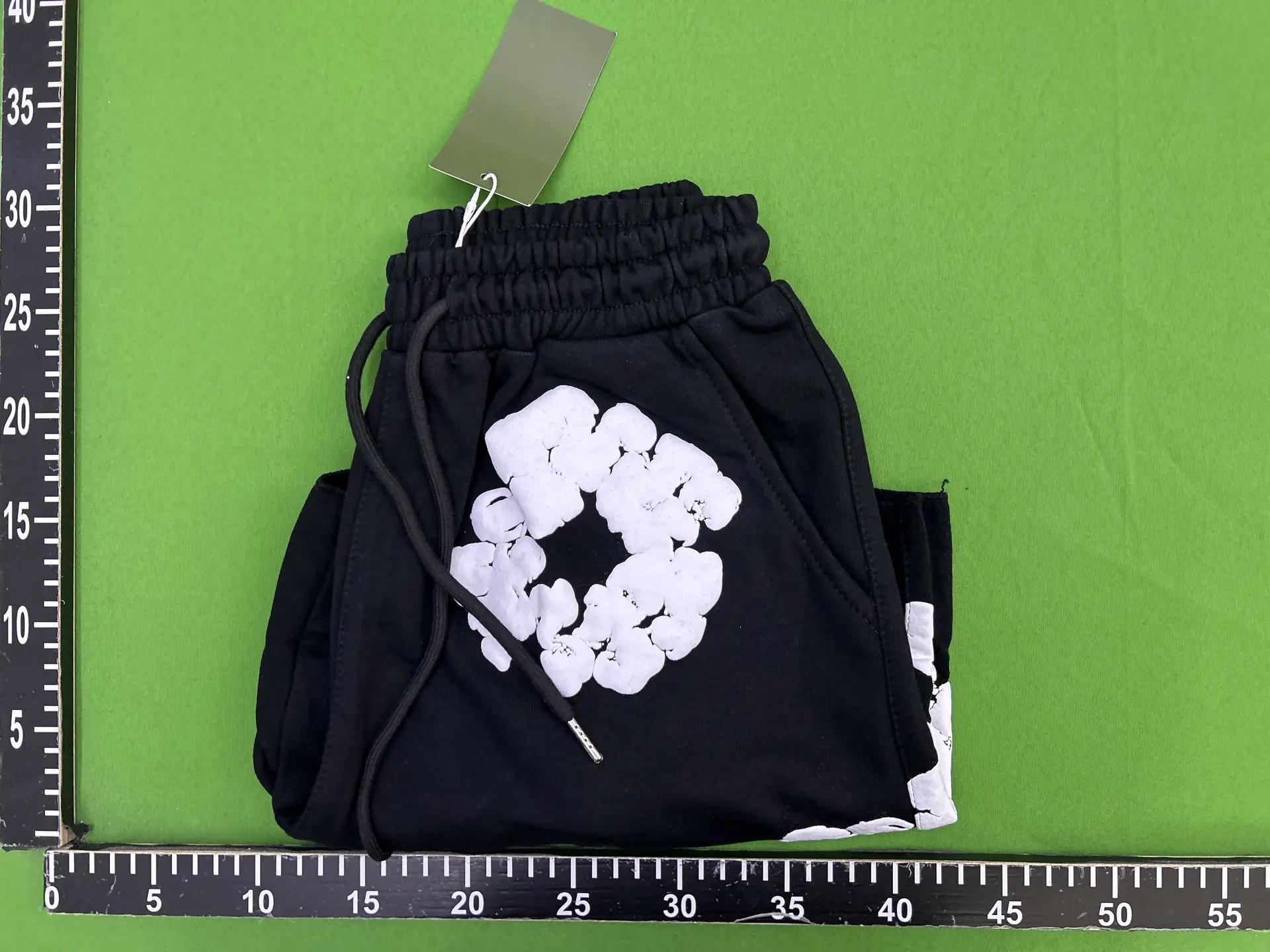 Black shorts with white graphic print