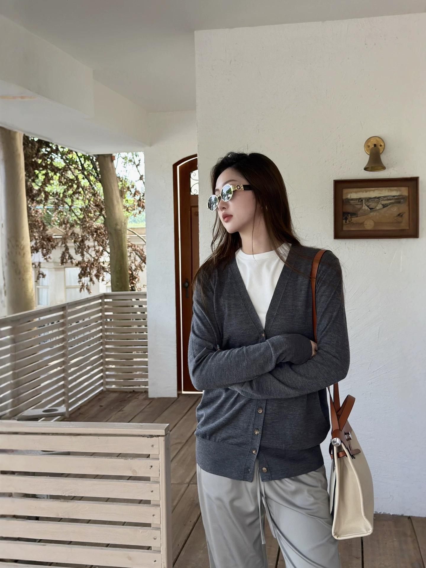 Warren Hailong |   Paula German Yangtze Yarn Wool Elegant V-Neck Long-Sleeve Cardigan Knitwear for Women.