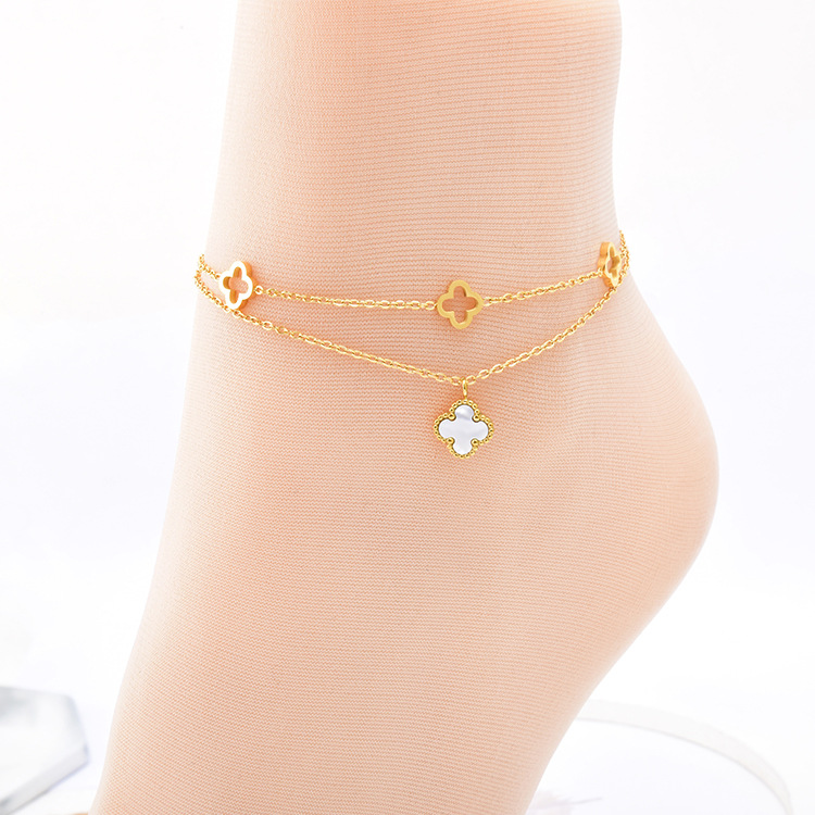 Fashion trend double-layer titanium steel anklet hollow flower white shell four-leaf flower accessories beach girls foot ring chain wholesale