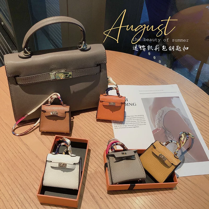 H Brand Mini Leather Kelly Bag Charm, Cute and Exquisite AirPods Earphone Case, Car Key Case, Car Pendant QC-foto van TAOBAO op Qualit.ly